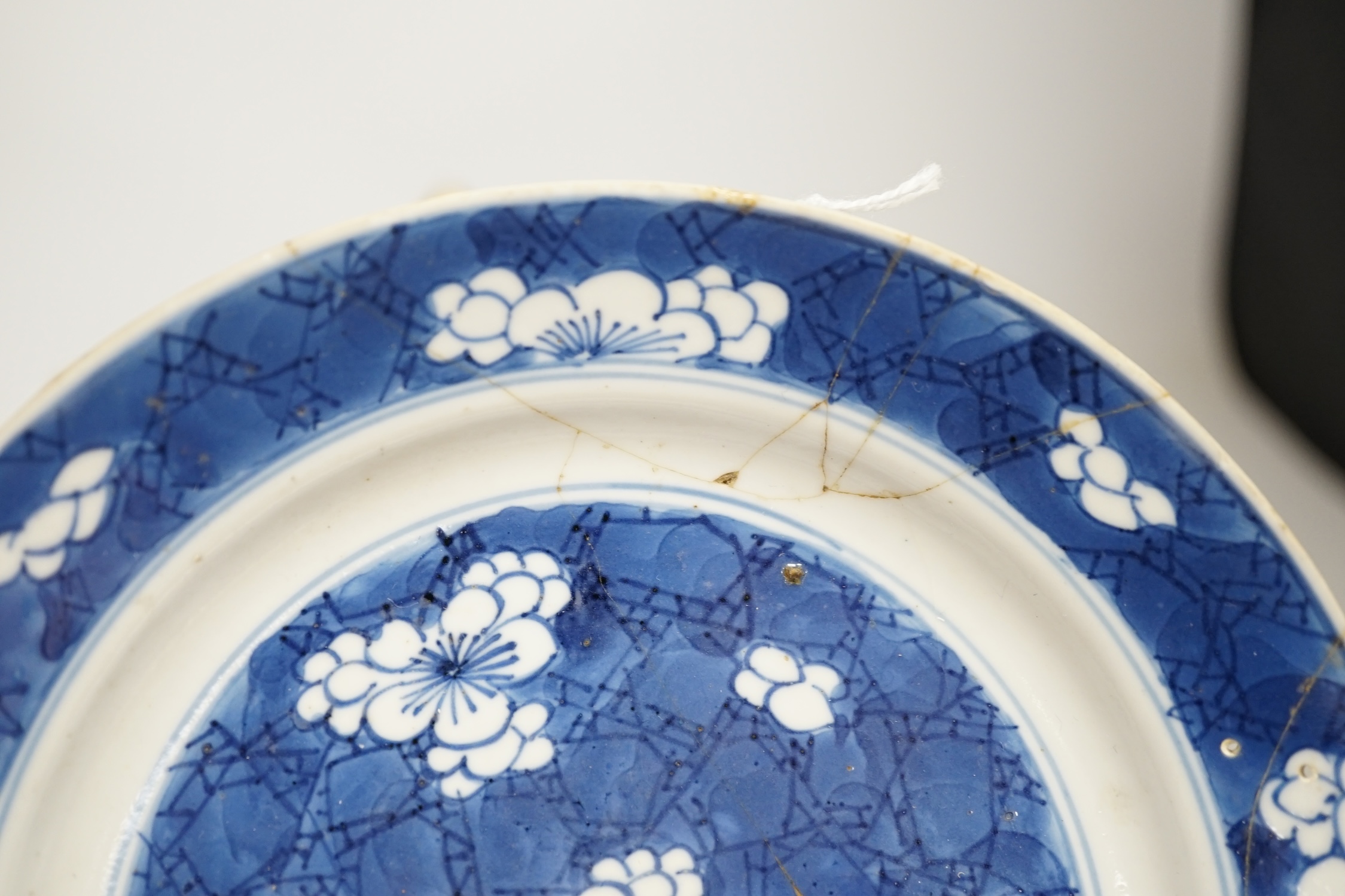 A Chinese blue and white teapot and cover, a prunus dish and an Imari patterned dish, all 18th century, teapot 19cm high. Condition - prunus dish and teapot cover chipped